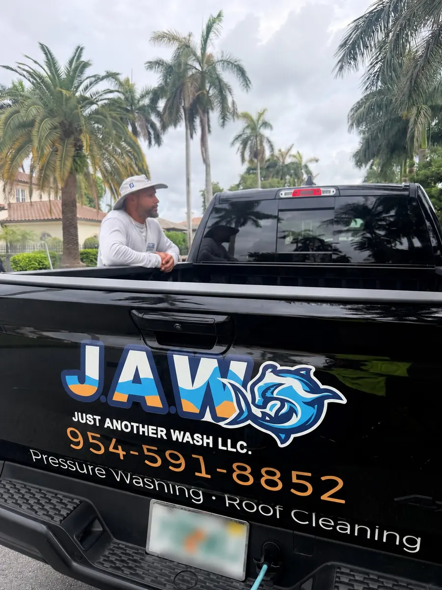 The owner of Just Another Wash in front of the company truck